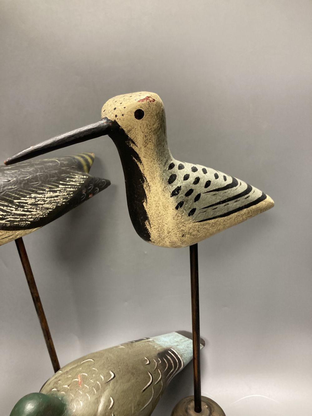 Two painted decoy wading birds on stands and a pigeon on stand, tallest 50cm